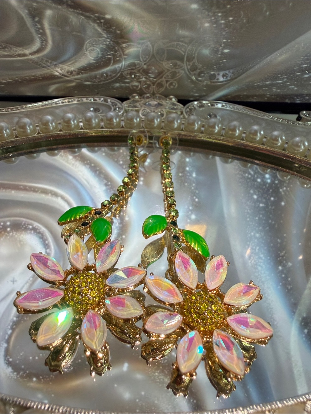 Gold Floral Drop Earrings with Iridescent Petals and Green Leaves